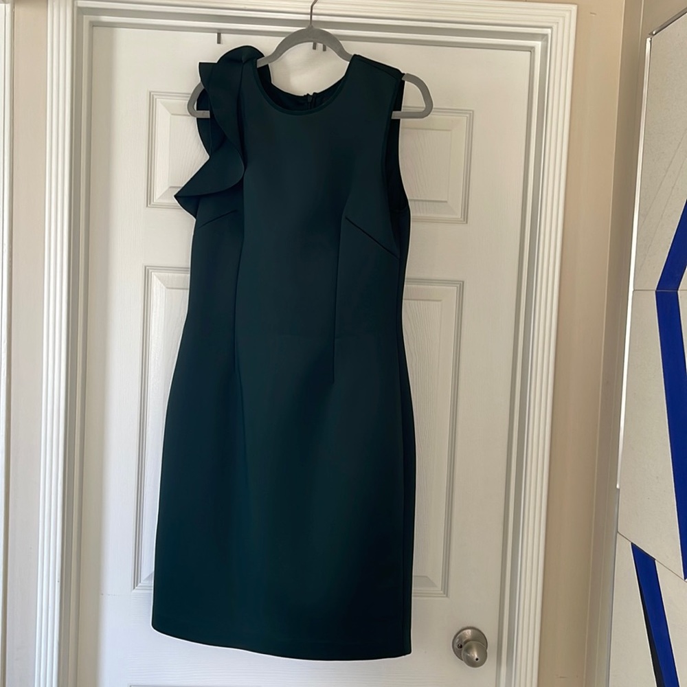 Stunning deep emerald green scuba sheath dress with ruffle accent